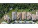 Aerial view of the home's expansive lot, nestled amongst mature trees providing a sense of privacy at 2630 Yellow Sundial Loop, Ruskin, FL 33570