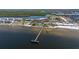 View from above of a wooden pier and beach, showcasing the beautiful waterfront and recreational amenities at 2630 Yellow Sundial Loop, Ruskin, FL 33570