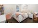 Charming bedroom featuring a plush bed, desk and natural light at 2630 Yellow Sundial Loop, Ruskin, FL 33570