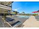 Relaxing community pool with ample seating and lounging options, perfect for enjoying sunny days at 2630 Yellow Sundial Loop, Ruskin, FL 33570