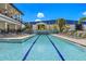 Inviting community pool with ample seating and lounge chairs, perfect for relaxing and socializing at 2630 Yellow Sundial Loop, Ruskin, FL 33570