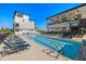 Community pool area offering ample seating, relaxation, and enjoyment for residents at 2630 Yellow Sundial Loop, Ruskin, FL 33570