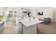 Bright and airy kitchen flows into living room, featuring quartz counters and stainless steel appliances at 2630 Yellow Sundial Loop, Ruskin, FL 33570