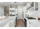 Bright kitchen with large island, stainless steel appliances, and an open layout to other living spaces at 2630 Yellow Sundial Loop, Ruskin, FL 33570