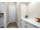 Functional mud room area with storage cabinets and countertop space at 2630 Yellow Sundial Loop, Ruskin, FL 33570