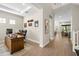 Spacious office with wooden desk, adjacent to living room and stairway at 2630 Yellow Sundial Loop, Ruskin, FL 33570