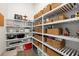 Organized walk-in pantry with ample shelving and storage, maximizing space and convenience at 2630 Yellow Sundial Loop, Ruskin, FL 33570