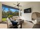 Covered outdoor patio with comfortable seating and a fire pit at 2630 Yellow Sundial Loop, Ruskin, FL 33570