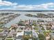 Scenic waterfront neighborhood with stunning bay views, luxurious homes, and lush tropical landscaping at 2710 Hibiscus W Dr, Belleair Beach, FL 33786