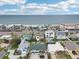 Aerial view of a beautiful home's location, only steps away from beach access on a sunny day at 2710 Hibiscus W Dr, Belleair Beach, FL 33786