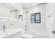 Bathroom with a glass-enclosed shower, modern fixtures, and vanity at 2710 Hibiscus W Dr, Belleair Beach, FL 33786