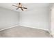 Empty bedroom featuring tile flooring, a ceiling fan and a closet at 2710 Hibiscus W Dr, Belleair Beach, FL 33786
