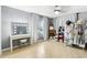 Spacious bedroom featuring a fireplace, vanity, and bright natural light at 2710 Hibiscus W Dr, Belleair Beach, FL 33786