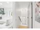 Hallway featuring tiled floor, a coat rack, and a bright white interior color scheme at 2710 Hibiscus W Dr, Belleair Beach, FL 33786