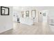 Open-concept kitchen with modern appliances, island, and bar at 2710 Hibiscus W Dr, Belleair Beach, FL 33786