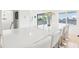 Large kitchen island with seating, perfect for entertaining guests at 2710 Hibiscus W Dr, Belleair Beach, FL 33786
