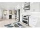 Modern kitchen with stainless steel appliances and ample counter space at 2710 Hibiscus W Dr, Belleair Beach, FL 33786