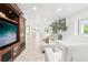 Spacious living room with entertainment center and stylish décor at 2710 Hibiscus W Dr, Belleair Beach, FL 33786