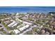 An aerial view shows the community, bay and bridge in the distance at 2904 Lichen Ln # A, Clearwater, FL 33760