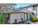 Charming house exterior with a cozy, enclosed porch and lovely landscaping at 2904 Lichen Ln # A, Clearwater, FL 33760