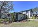 The side of a two story home with landscaping and an enclosed porch at 2904 Lichen Ln # A, Clearwater, FL 33760