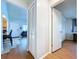 Hallway view of the entry door and eat-in kitchen with breakfast bar, and an entrance to the bedroom at 2904 Lichen Ln # A, Clearwater, FL 33760
