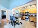 Bright kitchen featuring granite counters, wood cabinets, stainless steel appliances, and a breakfast bar with seating at 2904 Lichen Ln # A, Clearwater, FL 33760