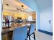 Bright kitchen featuring granite counters, wood cabinets, stainless steel appliances, and a breakfast bar with seating at 2904 Lichen Ln # A, Clearwater, FL 33760