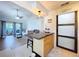 Open floor plan showcasing the kitchen island, living room with sliding glass doors to outdoor patio at 2904 Lichen Ln # A, Clearwater, FL 33760
