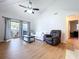 Bright living room with wood floors, vaulted ceilings, and access to balcony at 2904 Lichen Ln # A, Clearwater, FL 33760