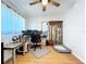 This home office includes wood floors, ceiling fan, and a view to the front yard at 2904 Lichen Ln # A, Clearwater, FL 33760