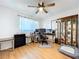 This home office includes wood floors, ceiling fan, and a view to the front yard at 2904 Lichen Ln # A, Clearwater, FL 33760