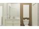 Well-lit bathroom featuring a vanity with a marble countertop and a shower with white subway tiles at 31711 Parkland Bay Way, San Antonio, FL 33576