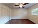 Clean bedroom featuring tile floors, a ceiling fan, and a closet for storage at 345 12Th N Ave, Safety Harbor, FL 34695