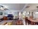 Open-concept living room with tile floors flowing into the dining area and kitchen at 345 12Th N Ave, Safety Harbor, FL 34695