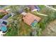 Aerial view of a home with a screened-in pool and well-maintained landscaping at 3701 Barnhouse Pl, Valrico, FL 33596