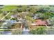 Residential aerial showcasing homes with mature trees, manicured lawns, and screened pools, highlighting a serene neighborhood at 3701 Barnhouse Pl, Valrico, FL 33596