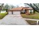 Charming home with well-maintained landscaping, a three-car garage, and an inviting exterior at 3701 Barnhouse Pl, Valrico, FL 33596