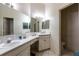 This bathroom offers dual sinks, ample counter space, and a neutral color palette at 3701 Barnhouse Pl, Valrico, FL 33596