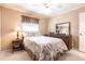 Inviting bedroom with a neutral color scheme and a comfortable full-sized bed at 3701 Barnhouse Pl, Valrico, FL 33596