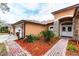 Charming single-story home with well-maintained landscaping, brick accents, and a welcoming double-door entrance at 3701 Barnhouse Pl, Valrico, FL 33596