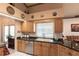 Kitchen with granite countertops, stainless steel appliances, and a window over the sink at 3701 Barnhouse Pl, Valrico, FL 33596