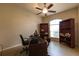Home office with large desk, bookshelves and a window for natural light at 3701 Barnhouse Pl, Valrico, FL 33596