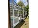 Enclosed pool area featuring an aluminum frame and mesh screen, offering an idyllic spot for relaxation and recreation at 3701 Barnhouse Pl, Valrico, FL 33596