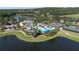 Beautiful aerial view of lakeside community pool and clubhouse area at 4507 Majestic Hill Loop, Brooksville, FL 34601