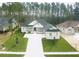 A beautifully landscaped, modern home exterior with a spacious front yard and driveway at 4507 Majestic Hill Loop, Brooksville, FL 34601