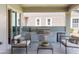 Covered outdoor kitchen featuring built-in grill, sink, fridge, and lounge seating at 4507 Majestic Hill Loop, Brooksville, FL 34601