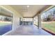 Covered outdoor patio with a built-in kitchen, grill, and bar area at 4507 Majestic Hill Loop, Brooksville, FL 34601