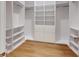 Spacious walk-in closet featuring custom shelving and drawers, maximizing storage space at 4507 Majestic Hill Loop, Brooksville, FL 34601