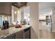 Stylish bar area featuring granite countertops and a modern wine cooler at 5301 Gulf Blvd # C202, St Pete Beach, FL 33706